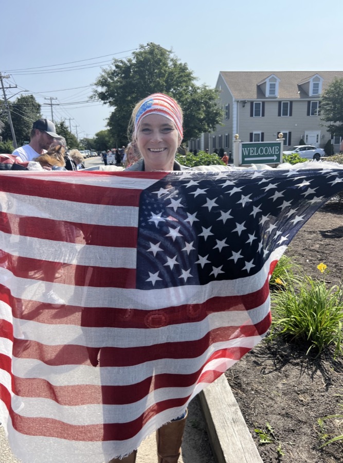 Neighbors standing up, flags flying.